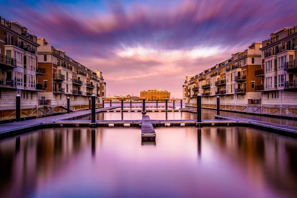 Long exposure at sunset of waterfront condominiums at the Inner Harbor, Baltimore, Maryland.