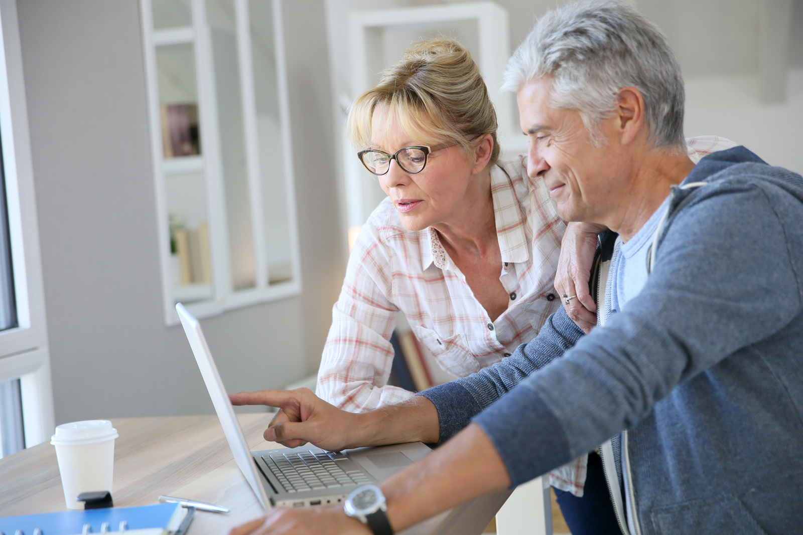 Couple reading digital guide on their computer